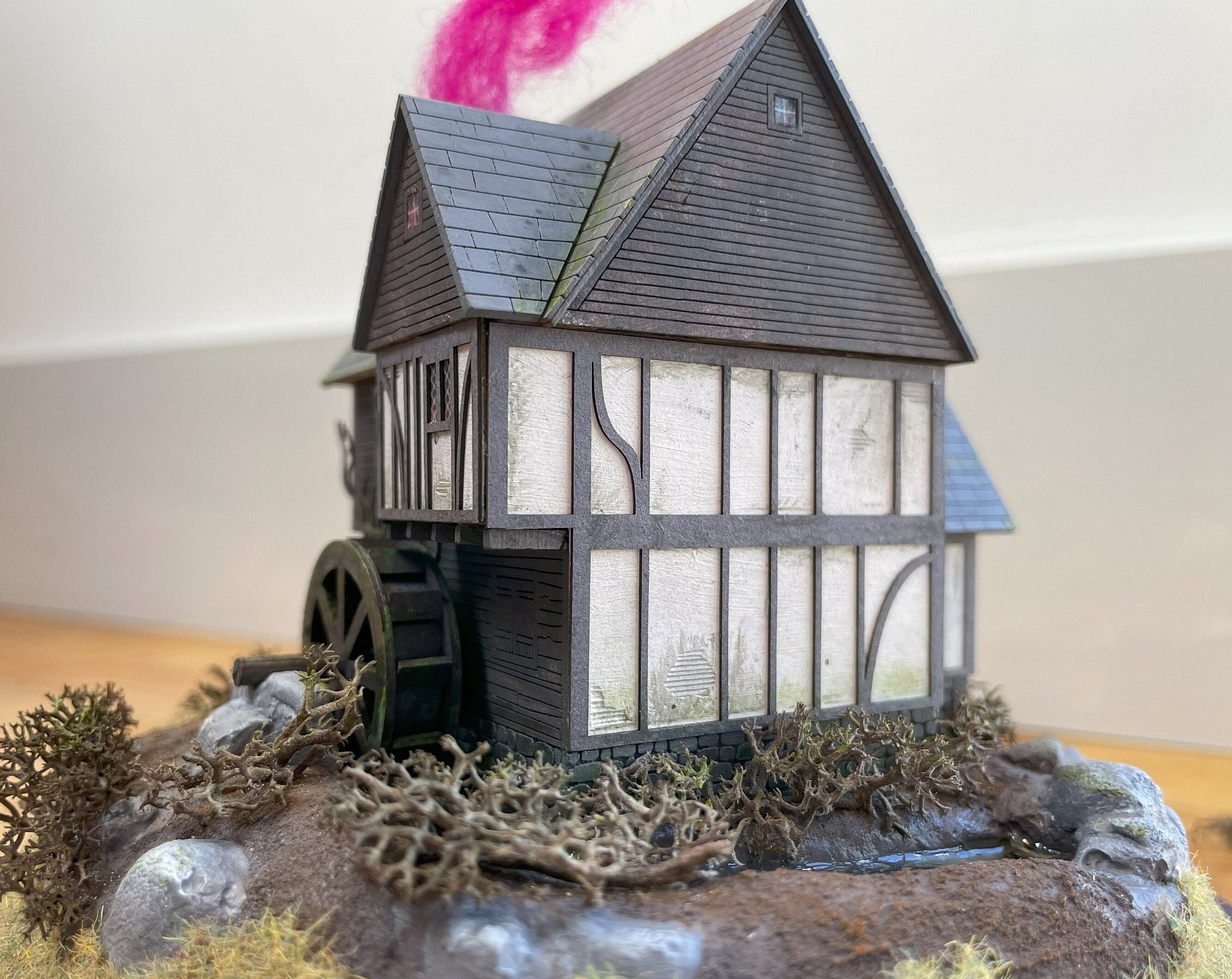 Model of Hocus Pocus cottage movie house in glass dome. Sanderson Sisters Cottage