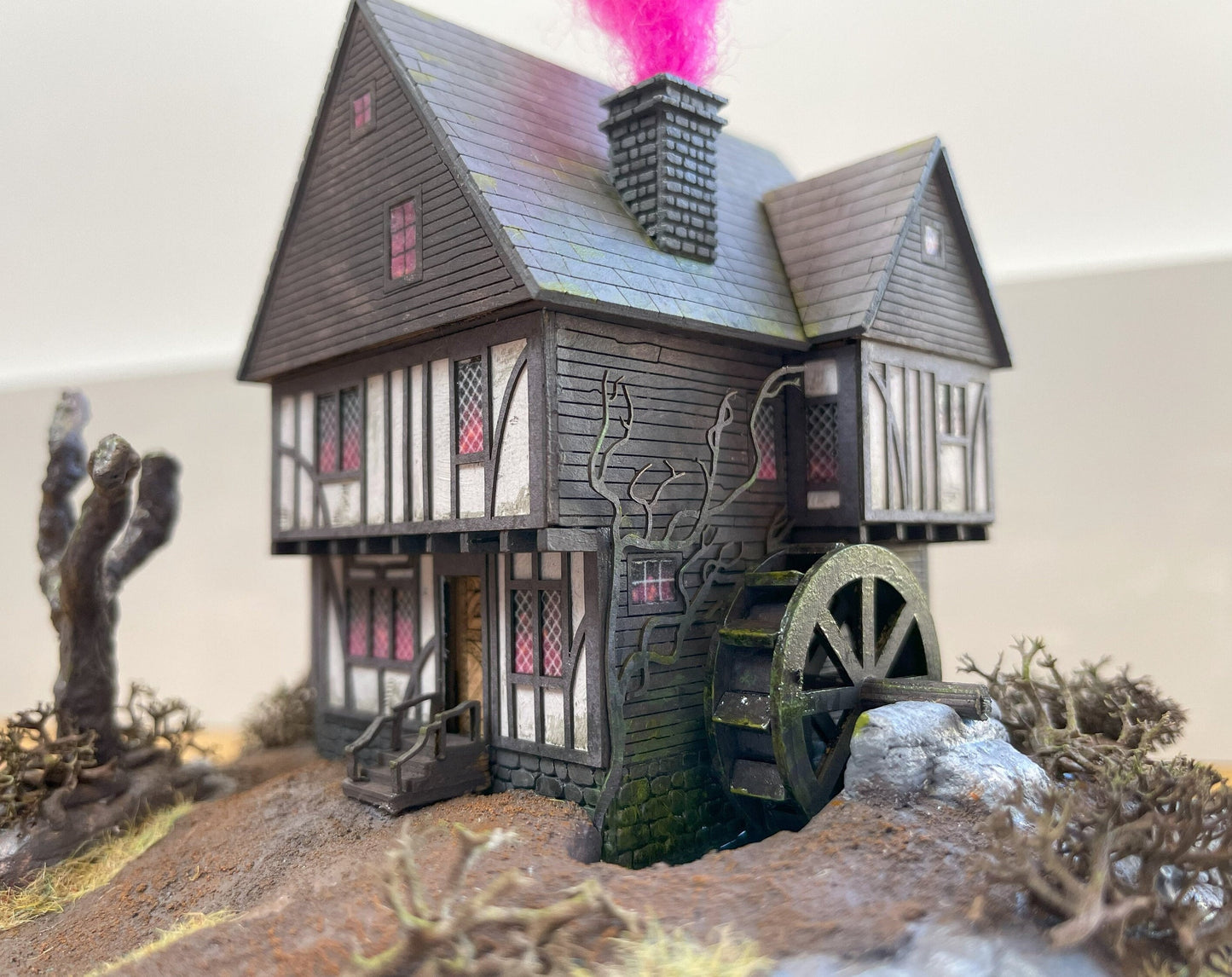 Model of Hocus Pocus cottage movie house in glass dome. Sanderson Sisters Cottage