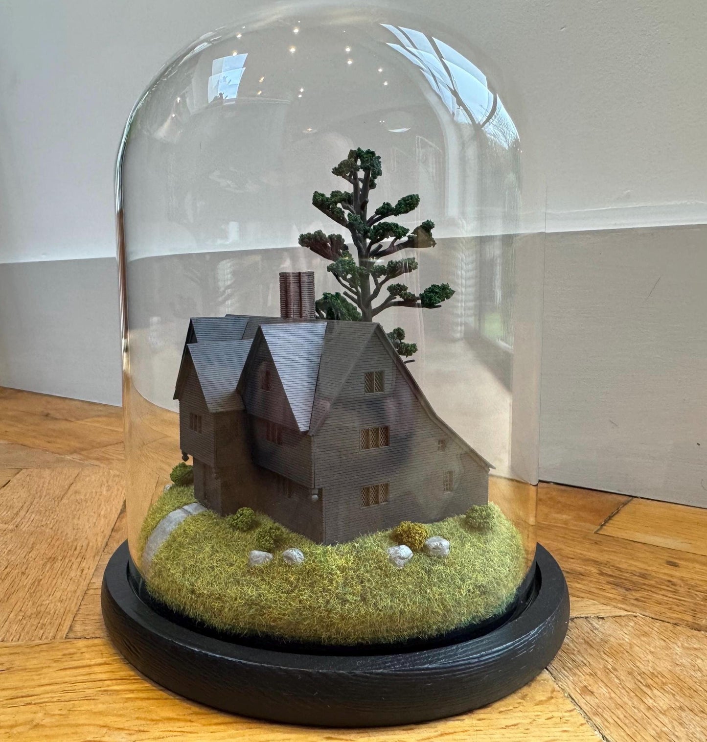 Model miniature Salem Witch House in glass dome