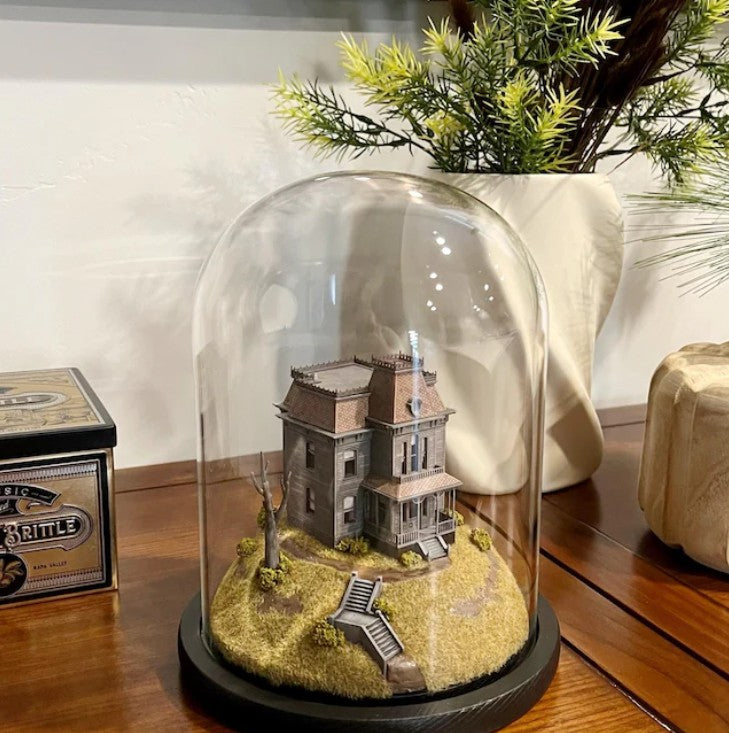 Model of Psycho movie house in glass dome. Bates Motel. Alfred Hitchcock