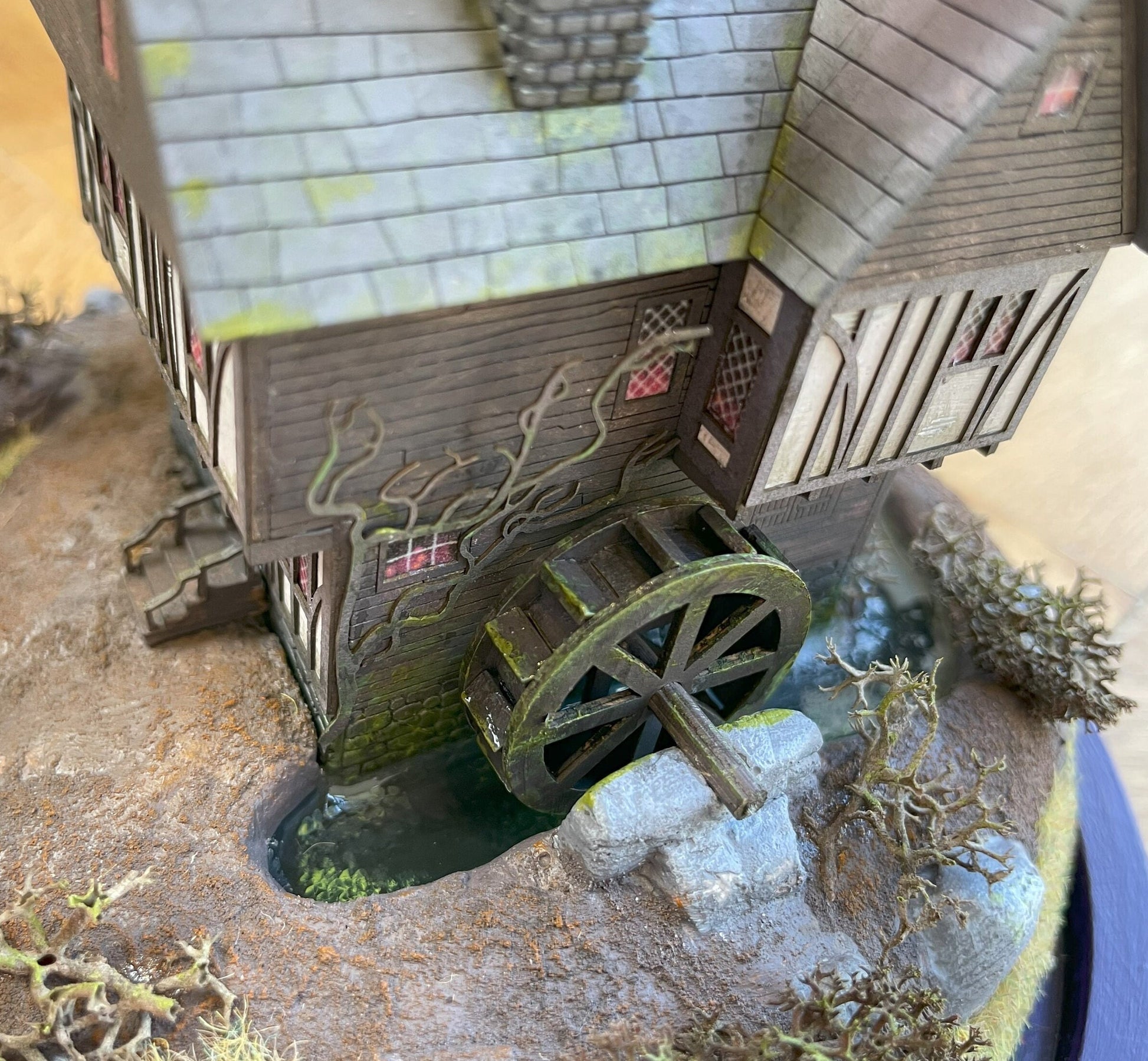 Model of Hocus Pocus cottage movie house in glass dome. Sanderson Sisters Cottage